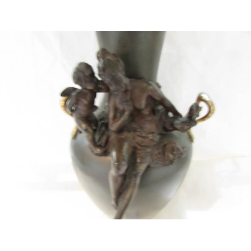 2178 - A bronze vase featuring figures of a lady and cherub.