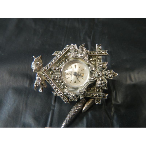 2063 - A marcasite watch and small cuckoo watch brooch