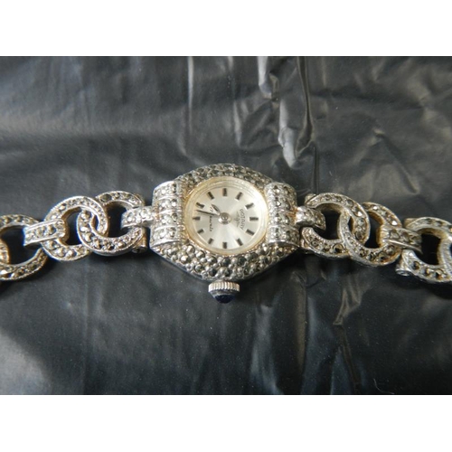 2063 - A marcasite watch and small cuckoo watch brooch