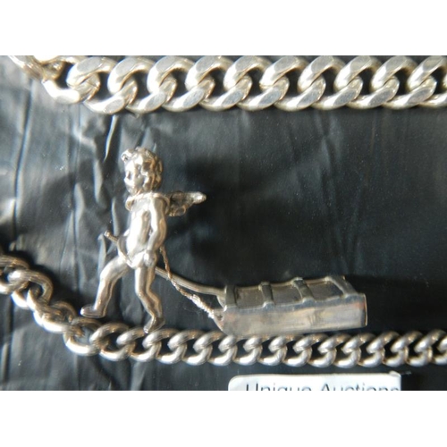 2071 - 2 silver bracelets and a silver cherub pulling sledge