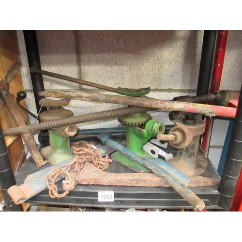 1053 - A good shelf of winding jacks and metalwork