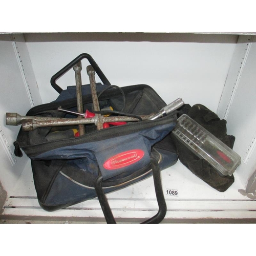 1089 - A toolbag with wheel braces and many tools etc