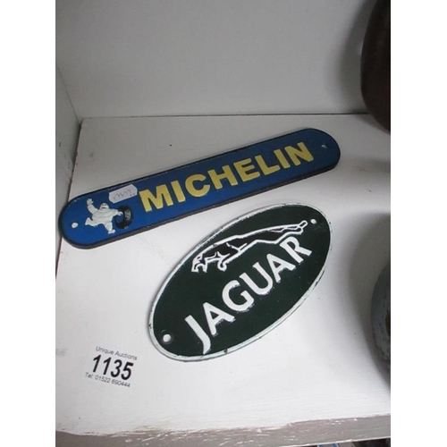 1135 - 2 cast iron Jaguar and Michelin signs