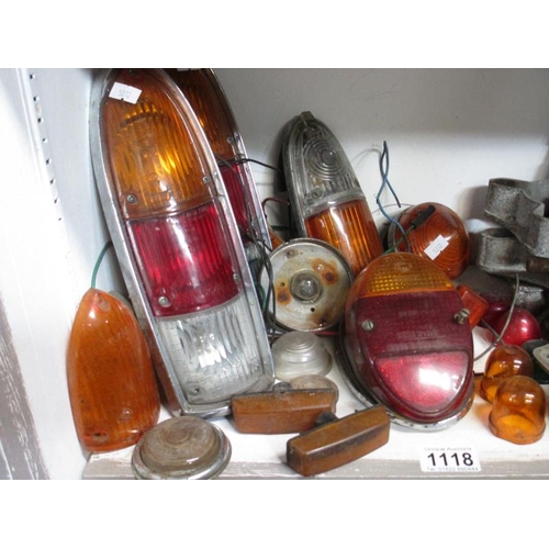 1118 - A good selection of lamps and lens including London Taxi, a full set of Mini type wheel spacers and ... 