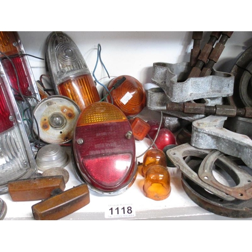 1118 - A good selection of lamps and lens including London Taxi, a full set of Mini type wheel spacers and ... 