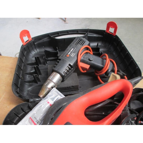 1435 - A Black & Decker boxed Sandstorm and hot air gun and a very large lot of 240v extension leads