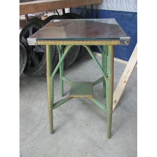 1477 - A Lloyd Loom style glass topped wicker table.