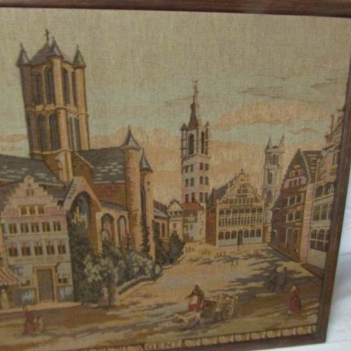 2369 - 2 framed tapestries of churches.