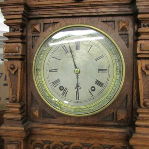 2403 - A late Victorian tall oak mantel/bracket clock with silvered dial, in very good condition. 28