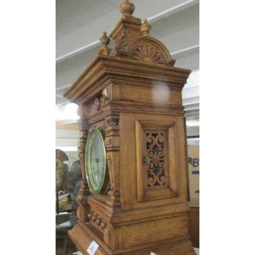 2403 - A late Victorian tall oak mantel/bracket clock with silvered dial, in very good condition. 28