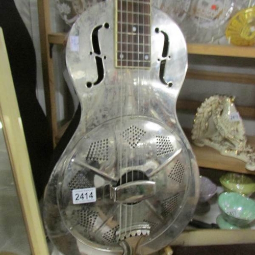 2414 - A Republic Resonator Guitar featuring chrome body and with hard case.