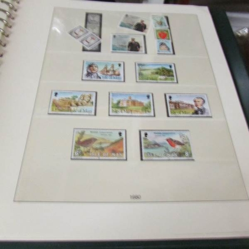 2466 - An album of Isle of Man stamps and an album of Gibraltar stamps.