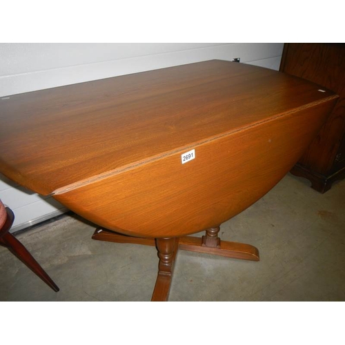 2691 - A good quality 4 pillar Ercol style drop leaf table.