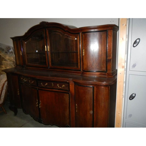 2706 - A large oak sideboard with cabinet top.