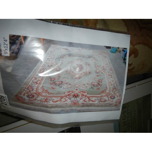 2709 - A large washed Chinese carpet, approximately 9' x 12'4''.