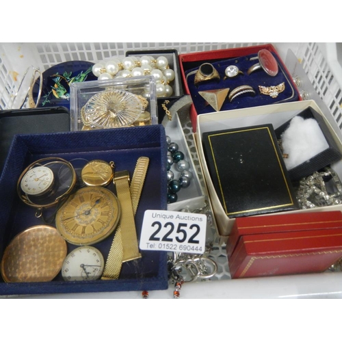 2252 - A large tray of good costume jewellery including rings, watch parts etc.,