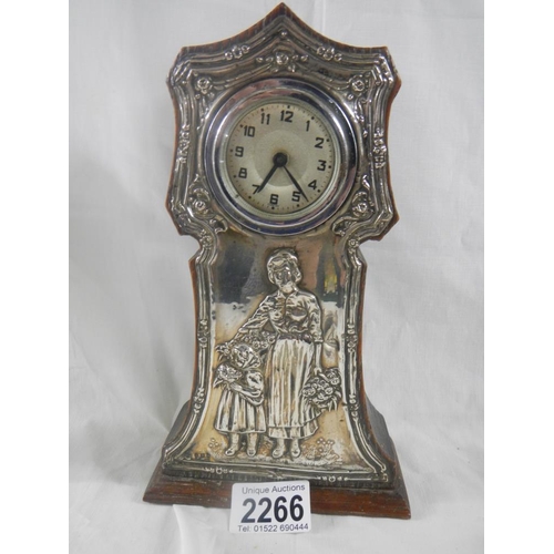 2266 - A silver framed mantel clock in good condition, 9'' tall