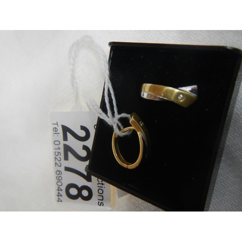 2278 - A pair of 2 tone yellow and white gold earrings.