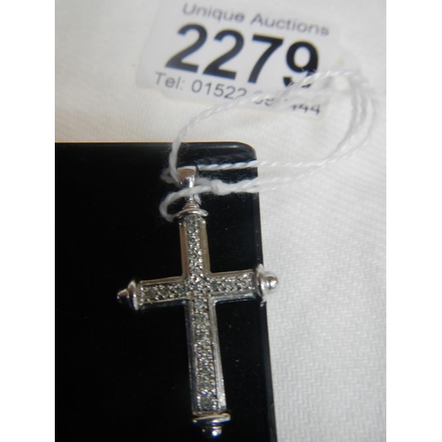 2279 - A white gold diamond cross.