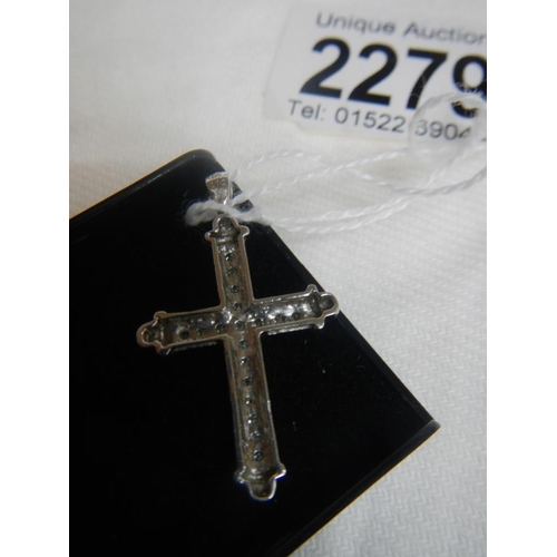 2279 - A white gold diamond cross.