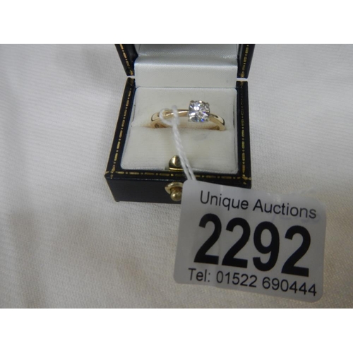 2292 - A half carat diamond solitaire yellow gold ring.