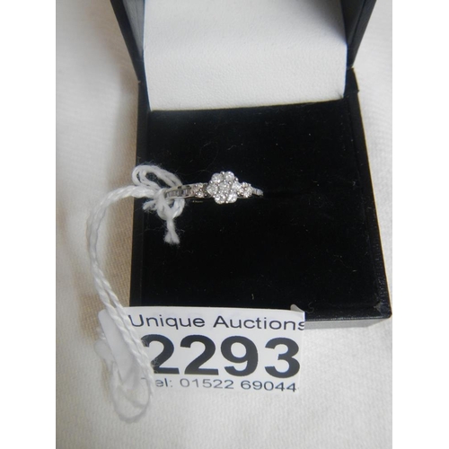 2293 - An 18ct white gold fine diamond ring with diamond set shoulders.