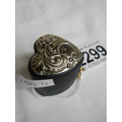 2299 - A heart shaped silver topped ring box.