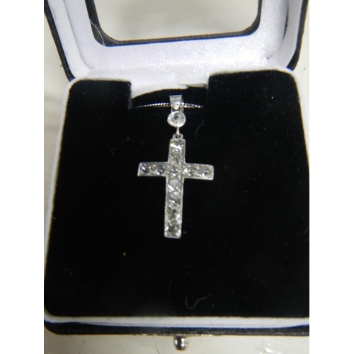 2309 - A diamond set cross old cut stones in white gold with attached 18ct white gold chain.