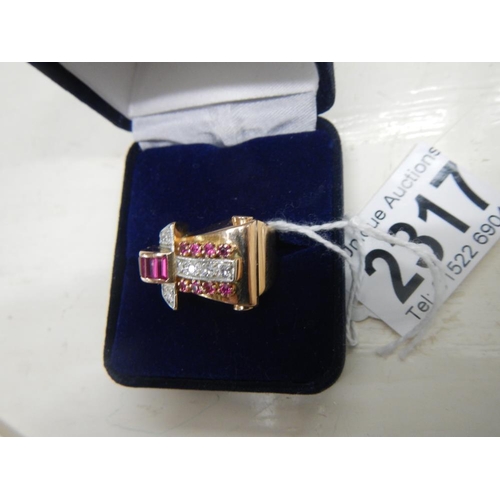 2317 - An art deco Odenesque design diamond and ruby ring in 14ct rose gold tested, total weight 12.2 grams... 