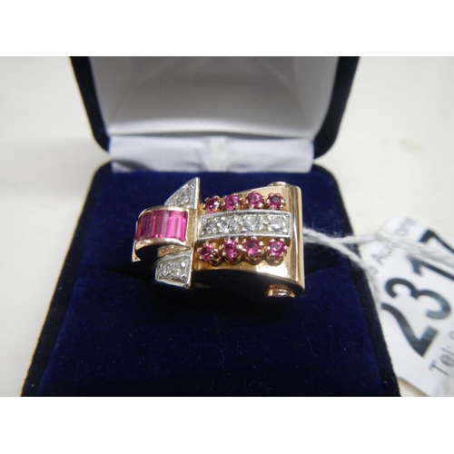 2317 - An art deco Odenesque design diamond and ruby ring in 14ct rose gold tested, total weight 12.2 grams... 