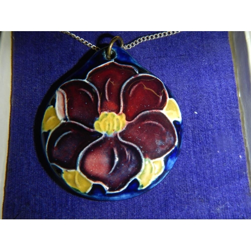 2319 - An original Moorcroft pendant attached silver chain, in box.