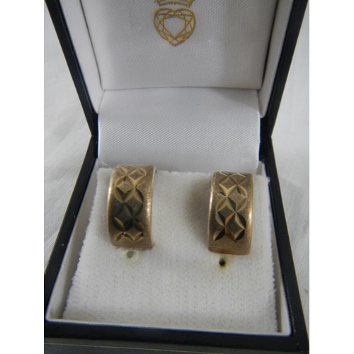 2328 - A pair of 1978 diamond cut ear loops in 9ct gold.