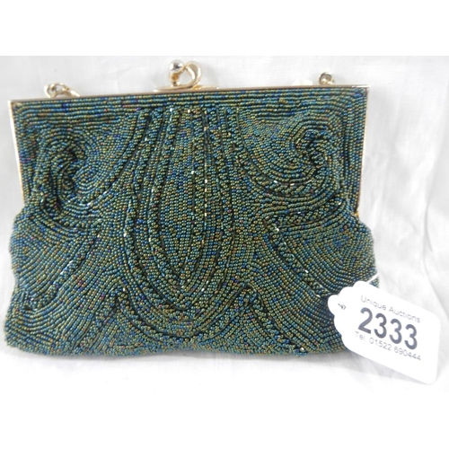 2333 - A fine quality beadwork evening bag together with a circa 1940's compact with stone set top.