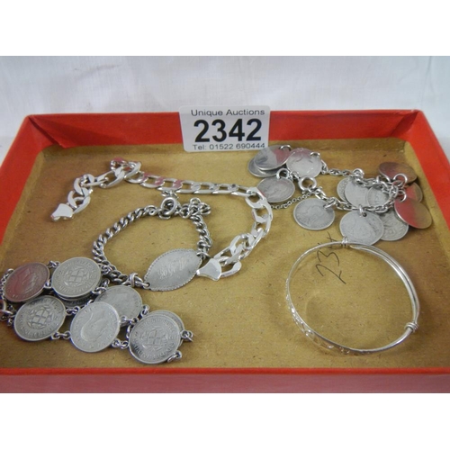 2342 - A mixed lot of silver including coin bracelets, chain, childs bracelet etc., approximately 62 grams.