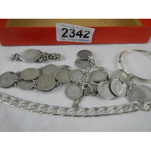 2342 - A mixed lot of silver including coin bracelets, chain, childs bracelet etc., approximately 62 grams.