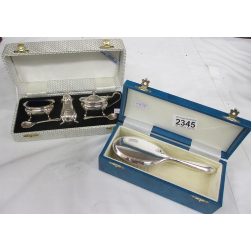 2345 - A boxed silver plate cruet set and a boxed silver plate brush.