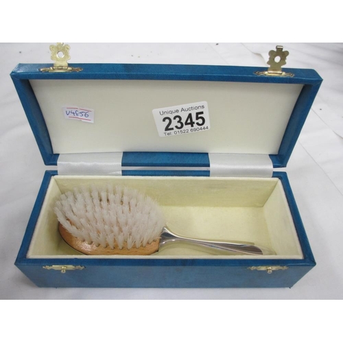 2345 - A boxed silver plate cruet set and a boxed silver plate brush.