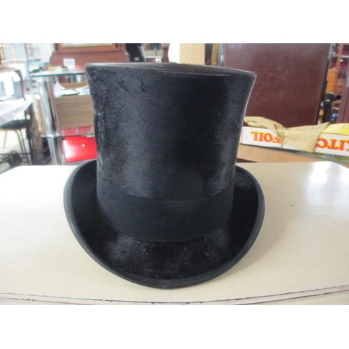 2525 - A leather cased silk top hat marked 'Lincoln', Bennett & Co., Sackville Street, Picadilly, London. H... 