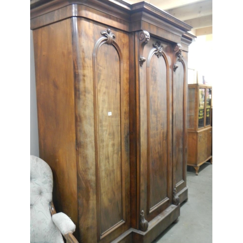 2674 - A Victorian mahogany 3 door combination wardrobe with 3 drawers in centre section .

The wardrobe is... 