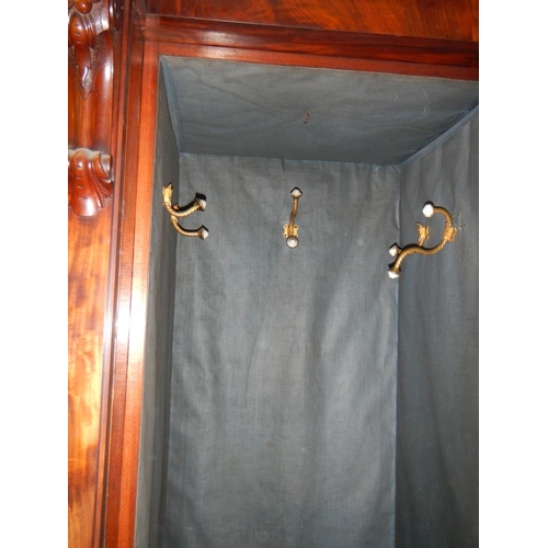 2674 - A Victorian mahogany 3 door combination wardrobe with 3 drawers in centre section .

The wardrobe is... 