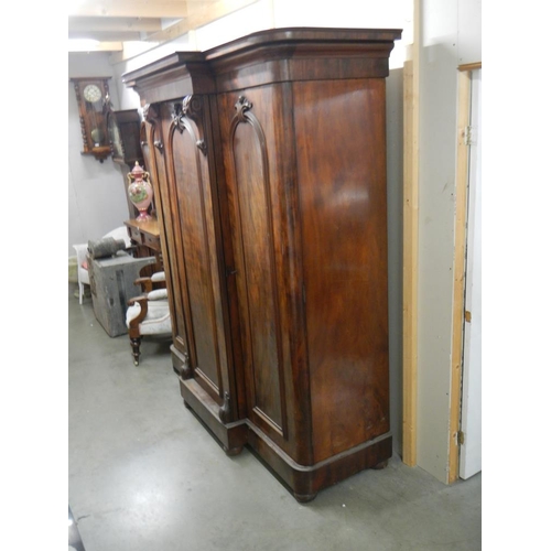 2674 - A Victorian mahogany 3 door combination wardrobe with 3 drawers in centre section .

The wardrobe is... 