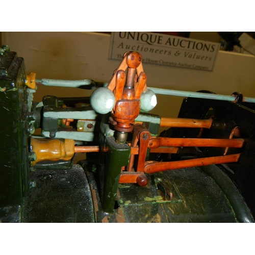 2515 - A handbuilt clockwork traction engine in custom built case on stand.  Cabinet is 78cm long x 46.5cm ... 