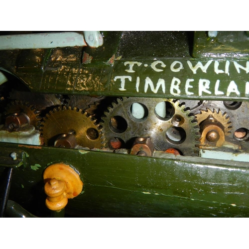 2515 - A handbuilt clockwork traction engine in custom built case on stand.  Cabinet is 78cm long x 46.5cm ... 