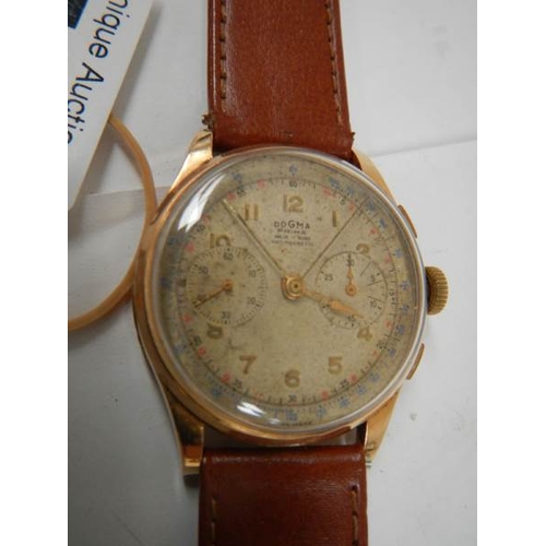 501 - A fine Dogma Prima wrist watch with 18ct gold back and calf strap, in full working order.