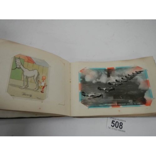 508 - An old autograph book containing aircraft pictures and Kensitas cigarette cards, approximately 28 pa... 