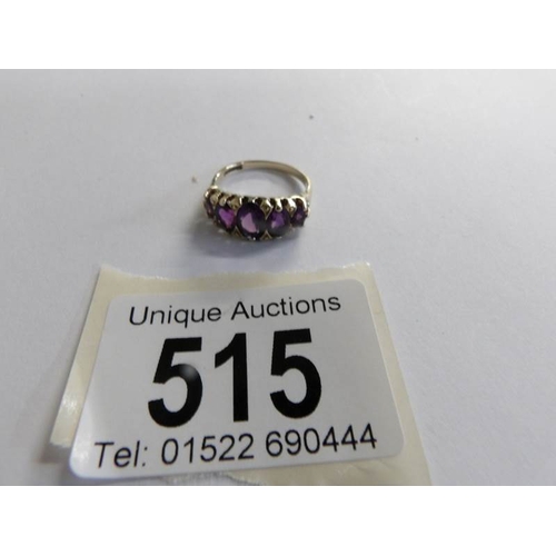 515 - A mid 20th century five stone amethyst set ring in 9ct gold, size M.