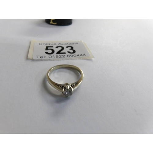 523 - A  single stone quarter carat diamond ring in 9ct gold together with a band ring in 9ct gold.