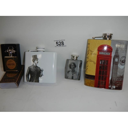 528 - 4 advertising hip flasks.