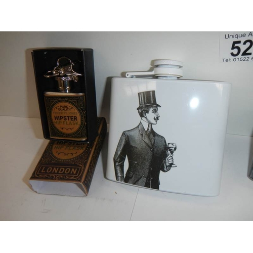 528 - 4 advertising hip flasks.