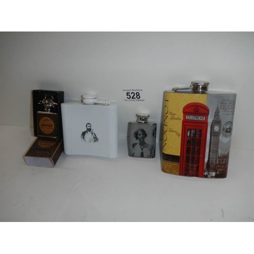 528 - 4 advertising hip flasks.